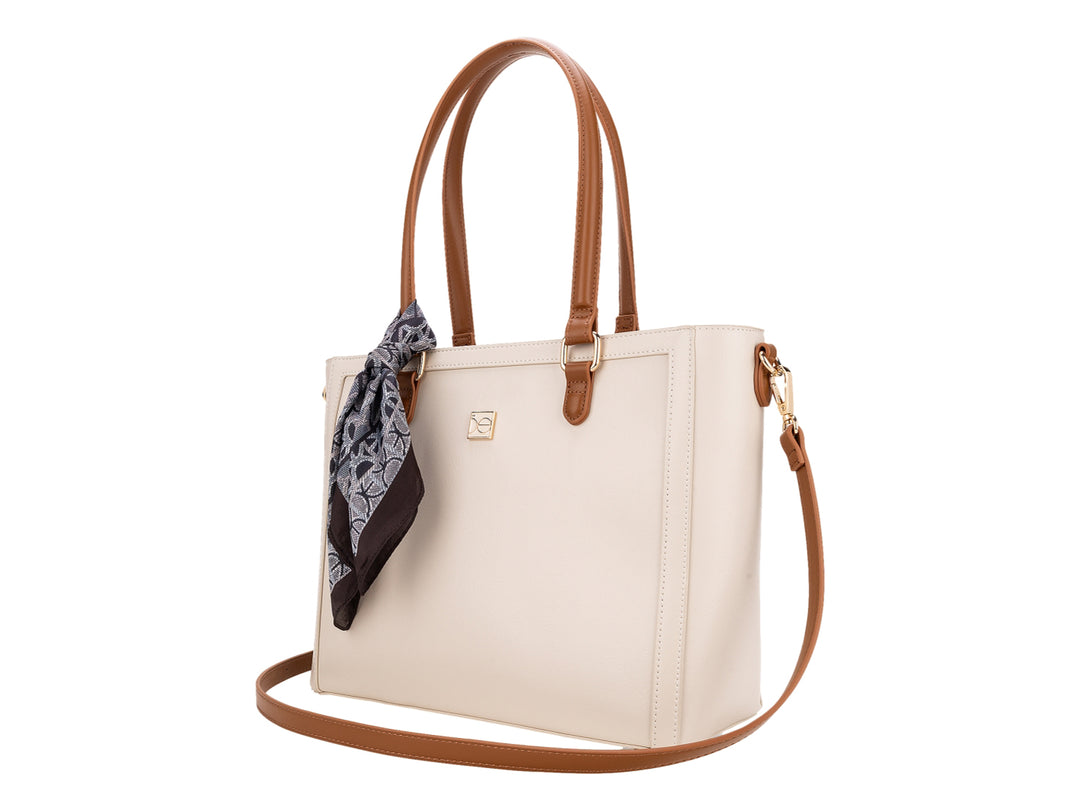 Bolso de hombro Cloe color beige con asas marrones y un pañuelo decorativo anudado en el asa.