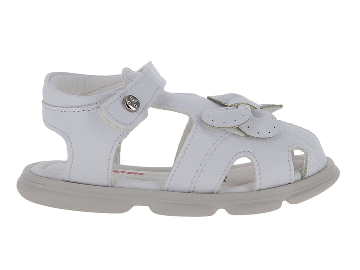 Sandalia blanca para niña con detalle de moño frontal y correa de ajuste con velcro.