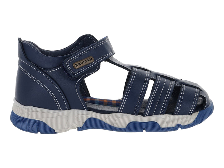 Sandalia Karsten para niño en color azul marino con suela gris y cierre de velcro.