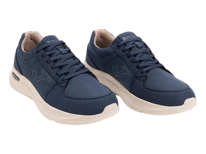 Tenis deportivos Joma color azul marino con suela blanca para hombre.