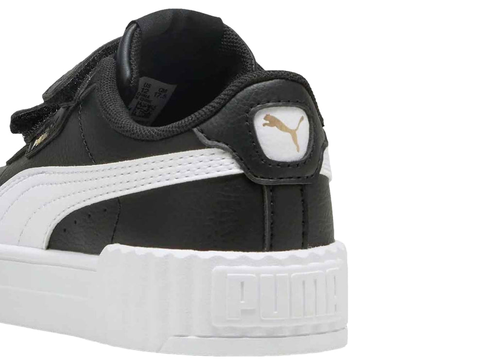 Tenis PUMA Carina 3.0 V PS en color negro con suela blanca de plataforma y cierre de velcro para niños.