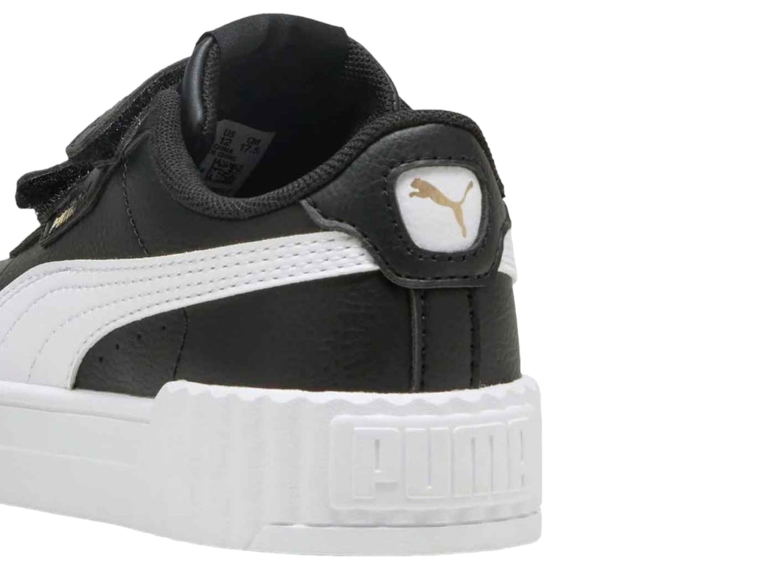 Tenis PUMA Carina 3.0 V PS en color negro con suela blanca de plataforma y cierre de velcro para niños.