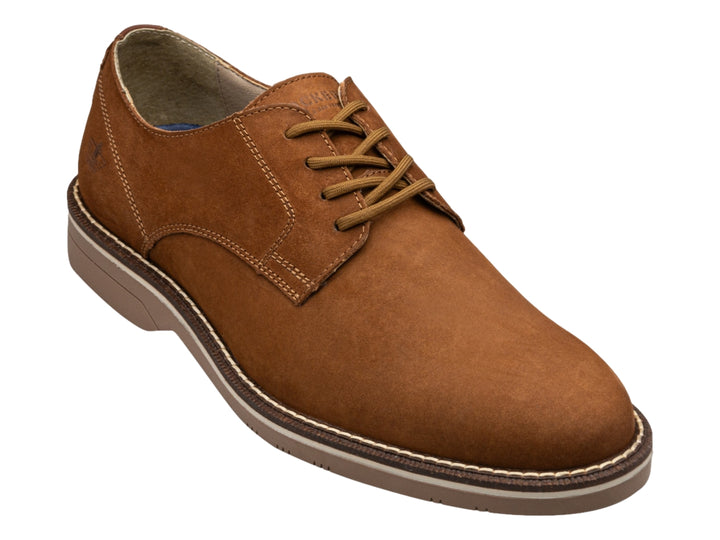 Zapato casual Dockers color cognac de cuero con cordones y suela plana blanca y café.