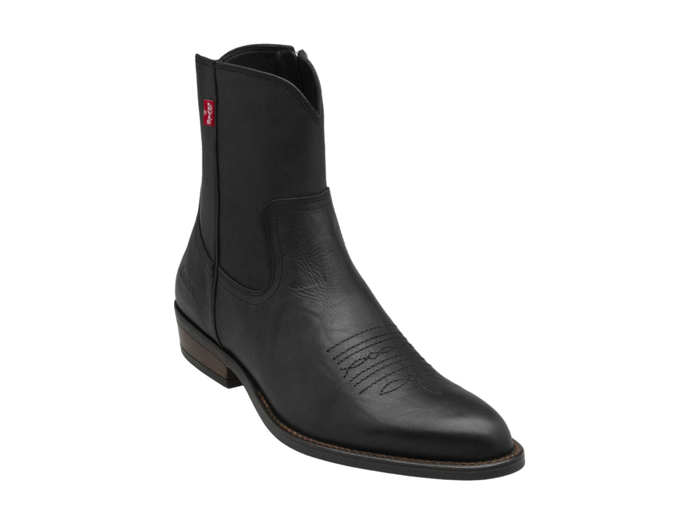 Bota negra de material sintético marca Levi's con tacón bajo y punta redondeada.