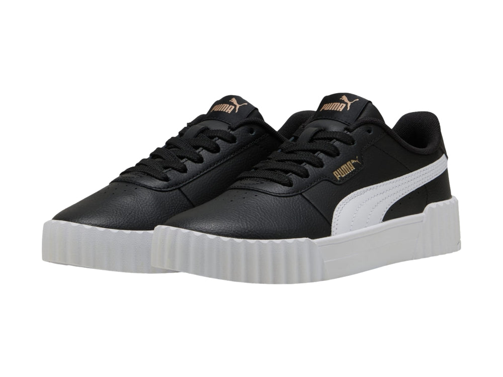 Tenis PUMA Carina 3.0 JR color negro con suela blanca de plataforma y detalles dorados.