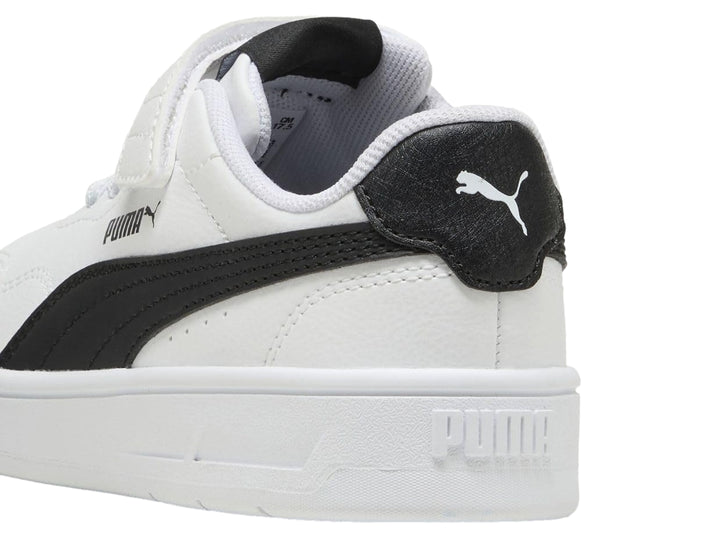 Tenis PUMA blancos para Niño con franja negra lateral y cierre de velcro.