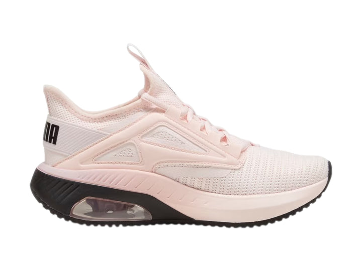 Tenis deportivos PUMA color rosa claro con suela negra y amortiguación visible en el talón.