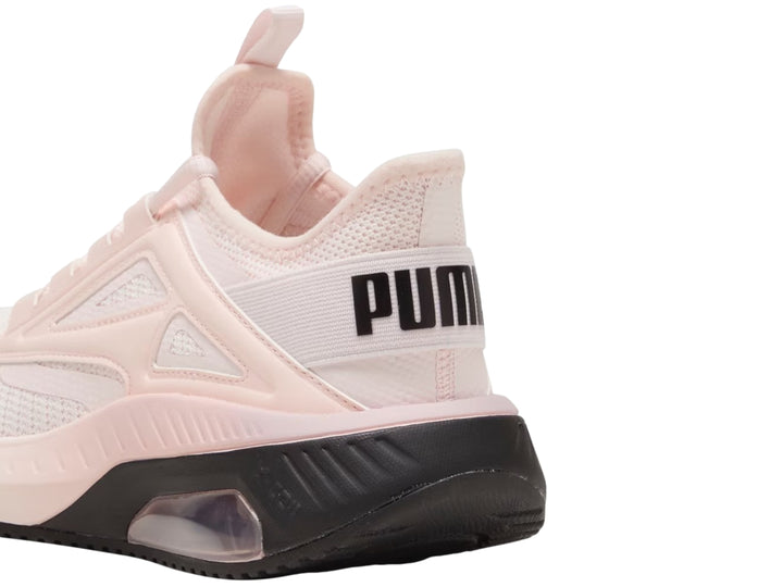 Tenis deportivos PUMA color rosa claro con suela negra y amortiguación visible en el talón.