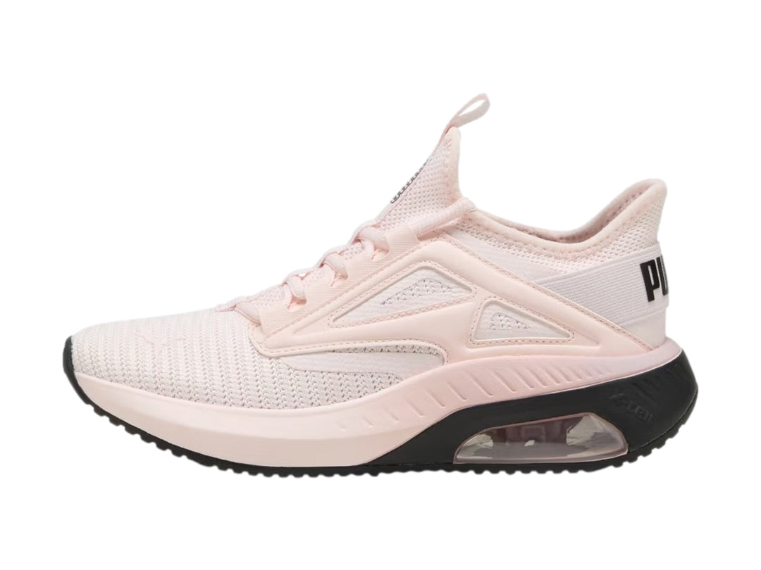 Tenis deportivos PUMA color rosa claro con suela negra y amortiguación visible en el talón.