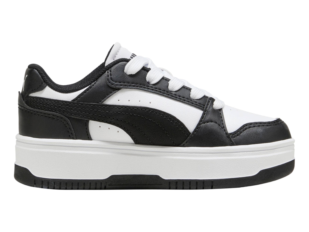 Tenis PUMA para Niña en colores blanco y negro con suela de plataforma blanca.