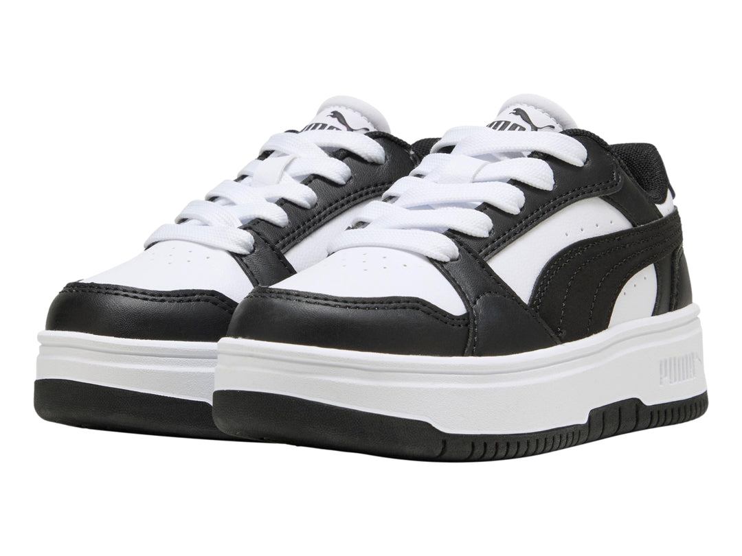 Tenis PUMA para Niña en colores blanco y negro con suela de plataforma blanca.