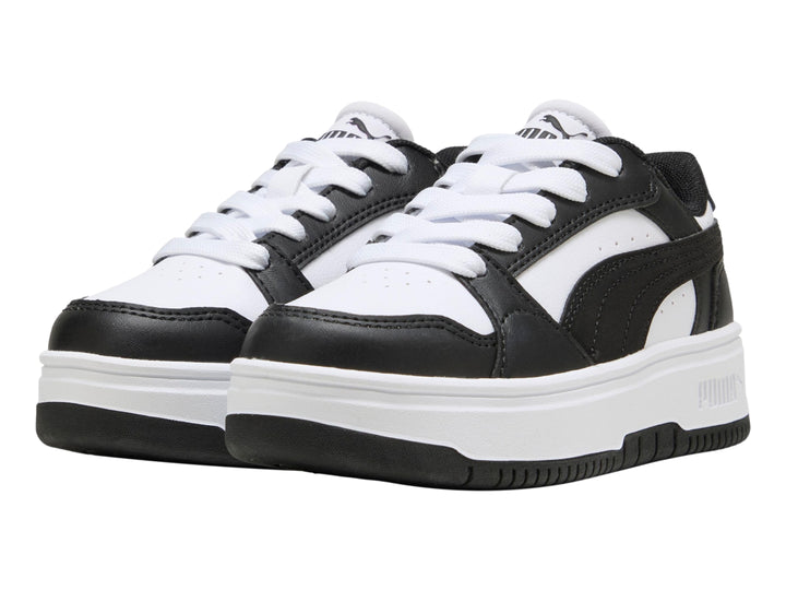 Tenis PUMA para Niña en colores blanco y negro con suela de plataforma blanca.