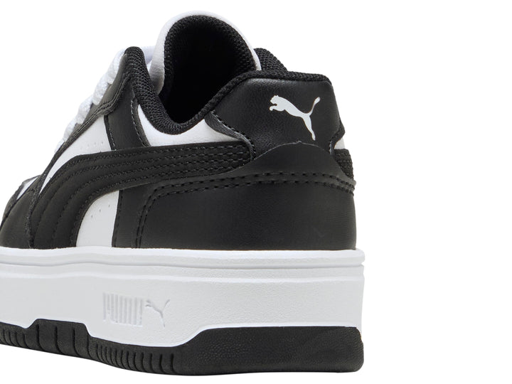 Tenis PUMA para Niña en colores blanco y negro con suela de plataforma blanca.