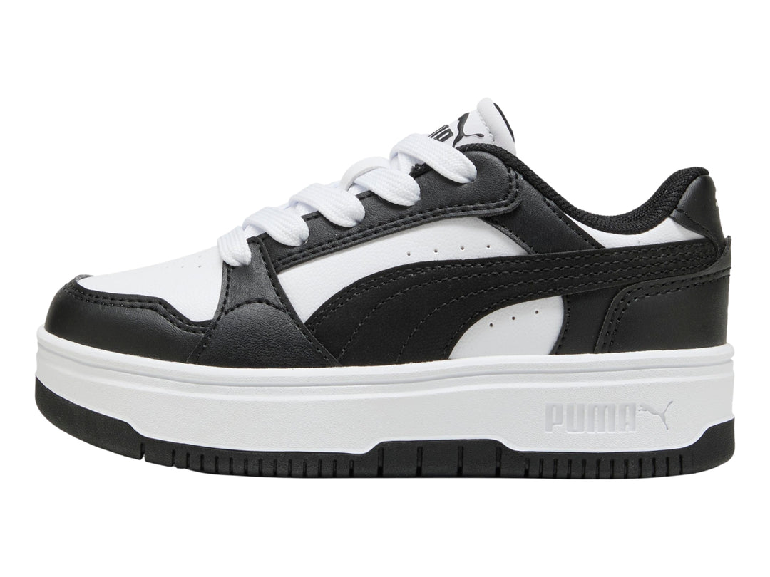Tenis PUMA para Niña en colores blanco y negro con suela de plataforma blanca.