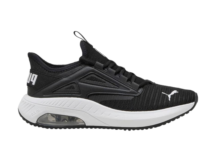 Tenis deportivos PUMA color negro con suela blanca y cámara de aire en el talón.