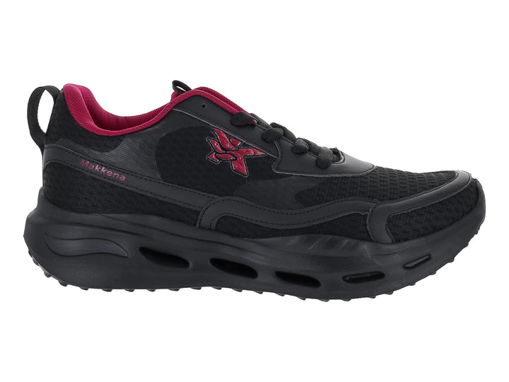 Tenis deportivos color negro con detalles en magenta y suela gruesa.