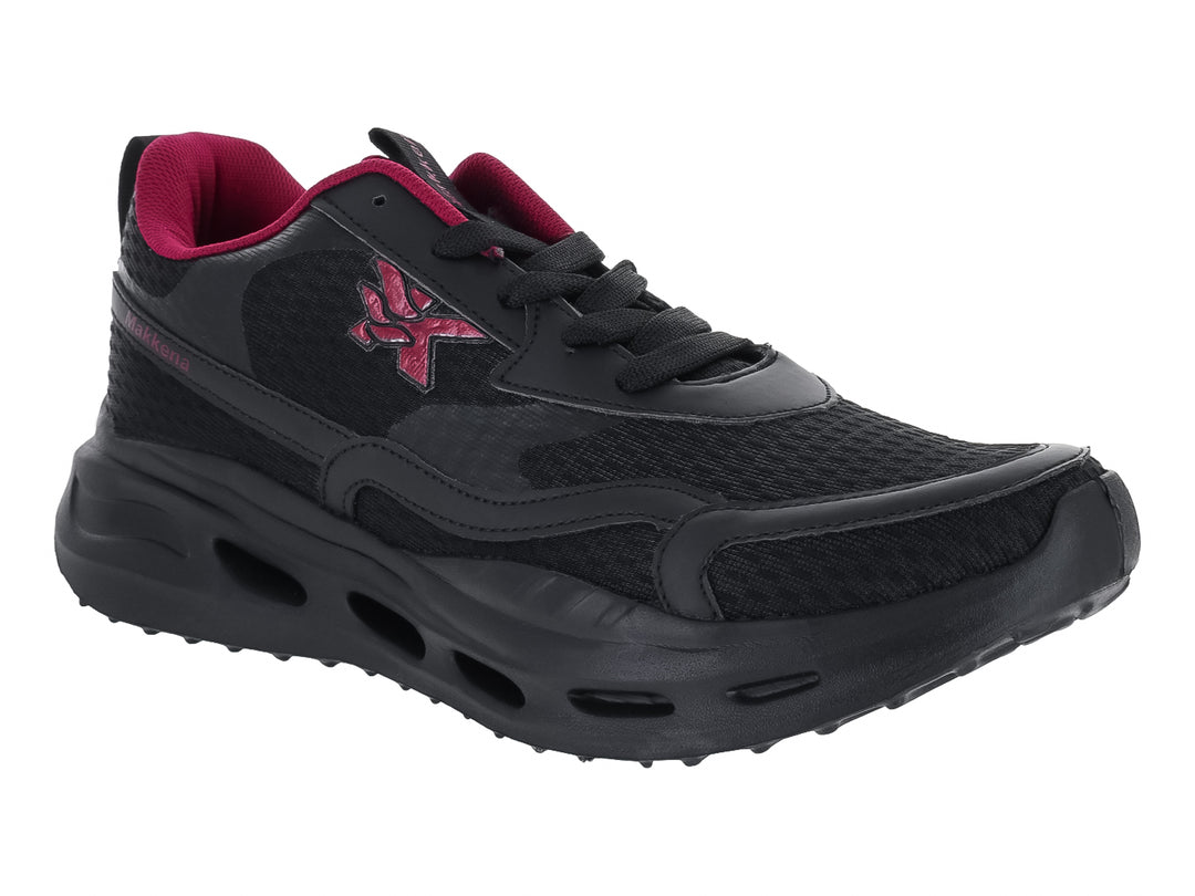 Tenis deportivos color negro con detalles en magenta y suela gruesa.
