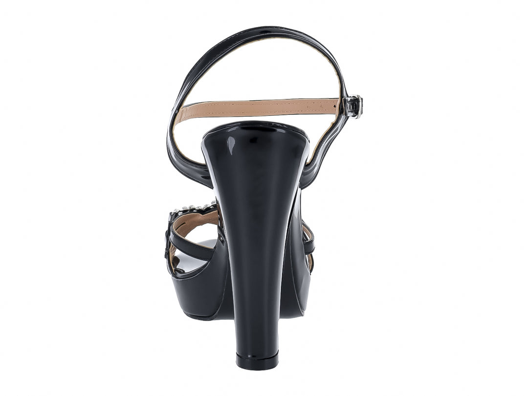 Sandalia de tacón alto y plataforma en charol negro con adorno brillante frontal.