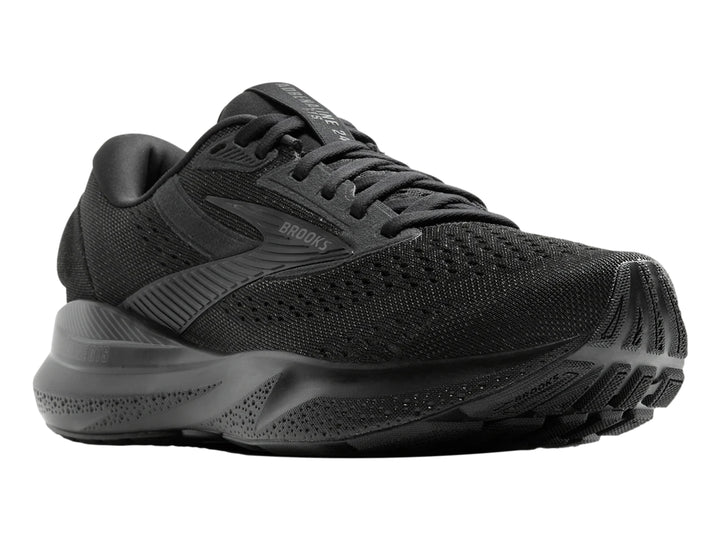 Zapato deportivo Brooks Adrenaline GTS 24 en color negro total con malla transpirable y suela amortiguada.