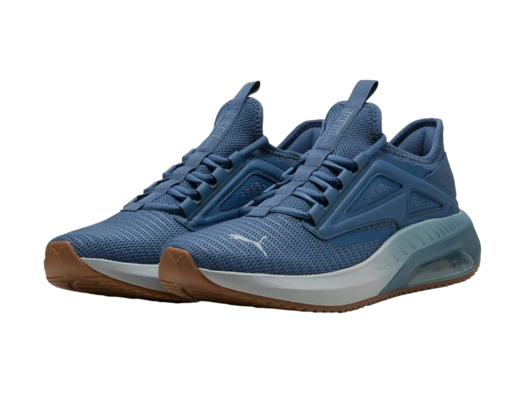 Tenis deportivos PUMA X-Cell Ayro en color azul oscuro con detalles en gris y suela marrón.