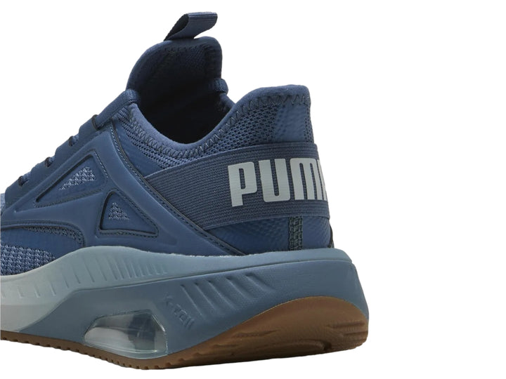 Tenis deportivos PUMA X-Cell Ayro en color azul oscuro con detalles en gris y suela marrón.