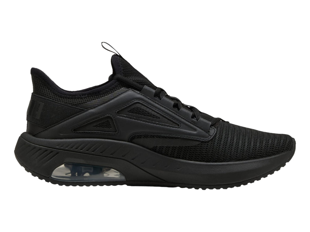 Tenis deportivos PUMA color negro con suela amortiguada y parte superior de malla transpirable.