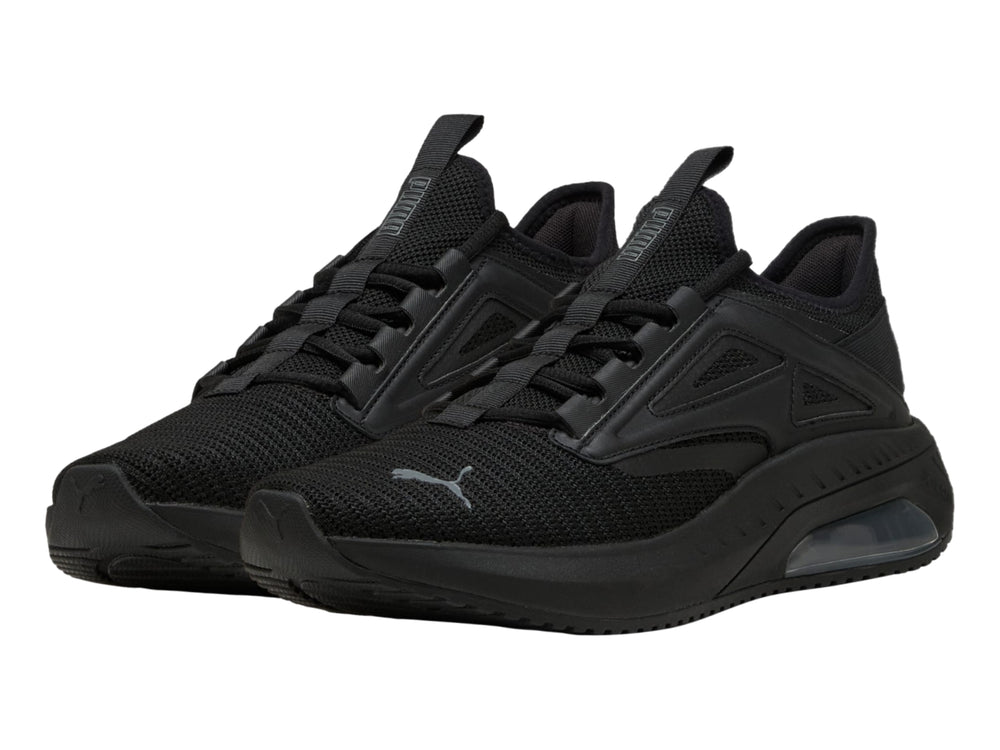 Tenis deportivos PUMA color negro con suela amortiguada y parte superior de malla transpirable.