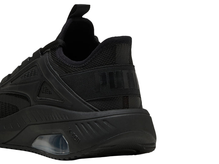 Tenis deportivos PUMA color negro con suela amortiguada y parte superior de malla transpirable.