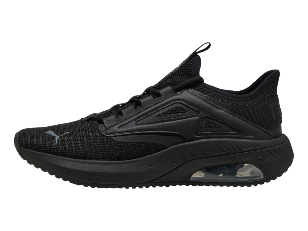 Tenis deportivos PUMA color negro con suela amortiguada y parte superior de malla transpirable.
