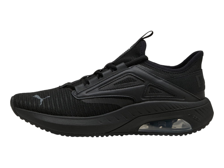 Tenis deportivos PUMA color negro con suela amortiguada y parte superior de malla transpirable.