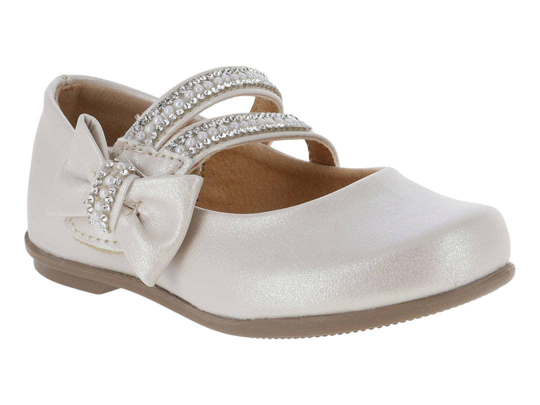 Zapato plano color beige para niña con moño decorativo y detalles de perlas brillantes.