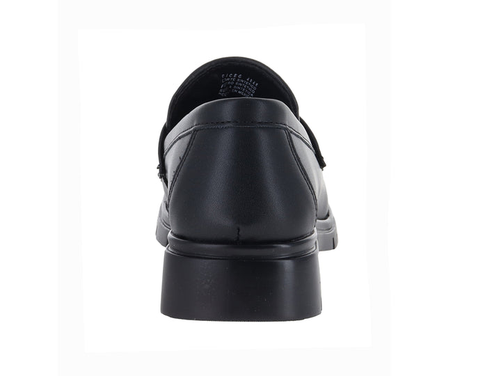 Zapato tipo mocasín color negro con hebilla dorada y suela de plataforma gruesa.