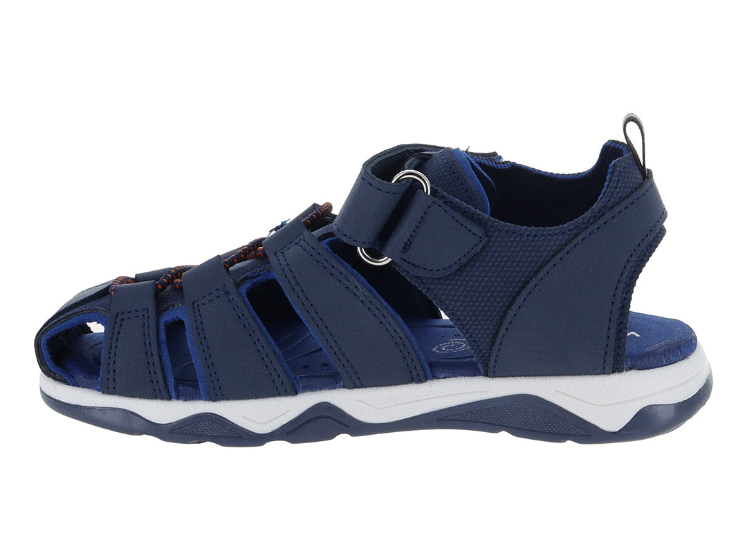 Sandalia deportiva para niño en color azul marino con suela blanca y cierre de velcro.