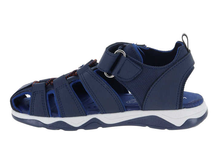 Sandalia deportiva para niño en color azul marino con suela blanca y cierre de velcro.