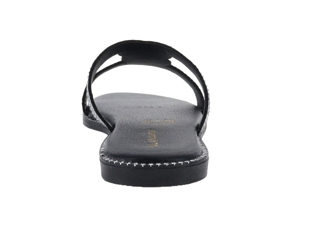 Sandalia plana color negro con tiras decoradas con brillantes plateados.