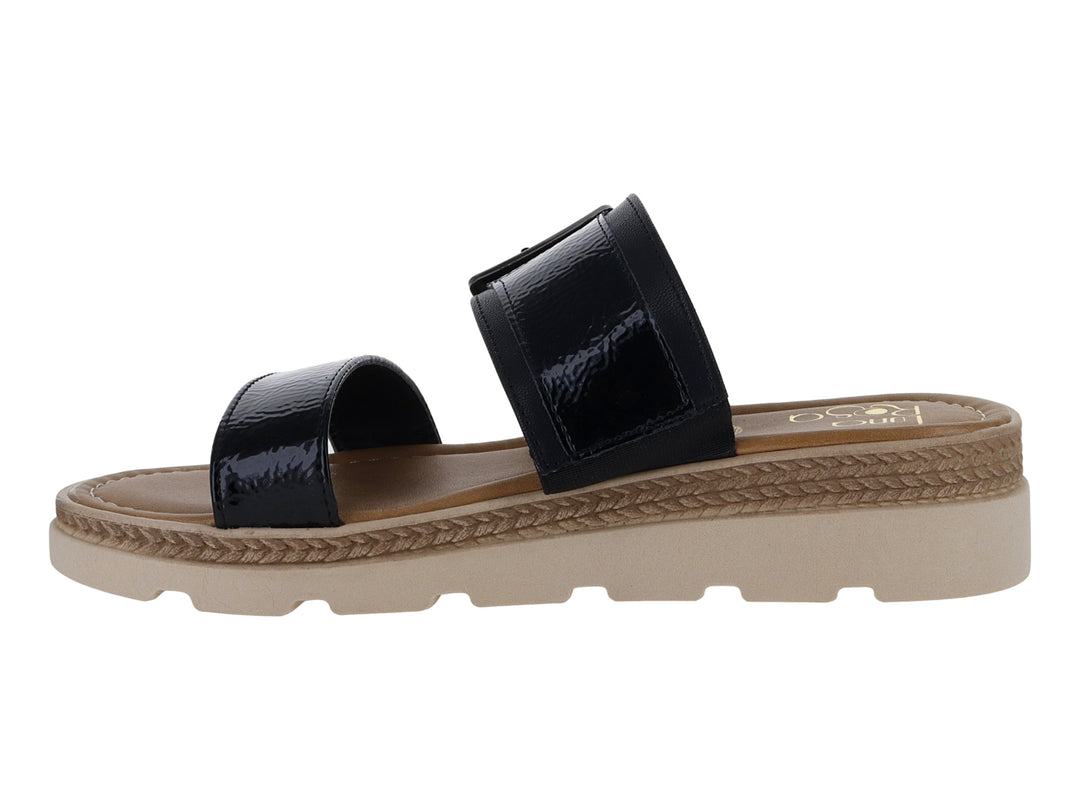 Sandalias negras de charol con plataforma beige y hebilla decorativa para mujer.
