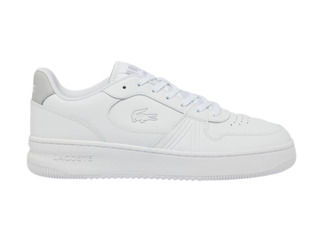 Tenis Lacoste blancos de corte bajo con talón gris y suela blanca.