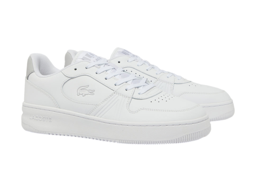 Tenis Lacoste blancos de corte bajo con talón gris y suela blanca.