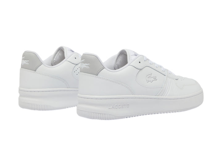 Tenis Lacoste blancos de corte bajo con talón gris y suela blanca.