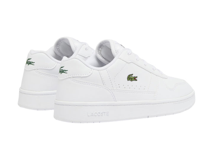 Tenis blancos Lacoste con logotipo de cocodrilo verde en el lateral.