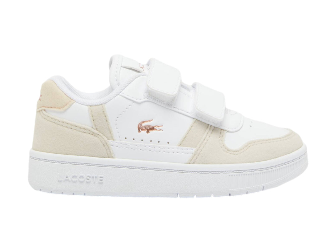 Tenis blancos con detalles en rosa claro y cierre de velcro de la marca Lacoste.