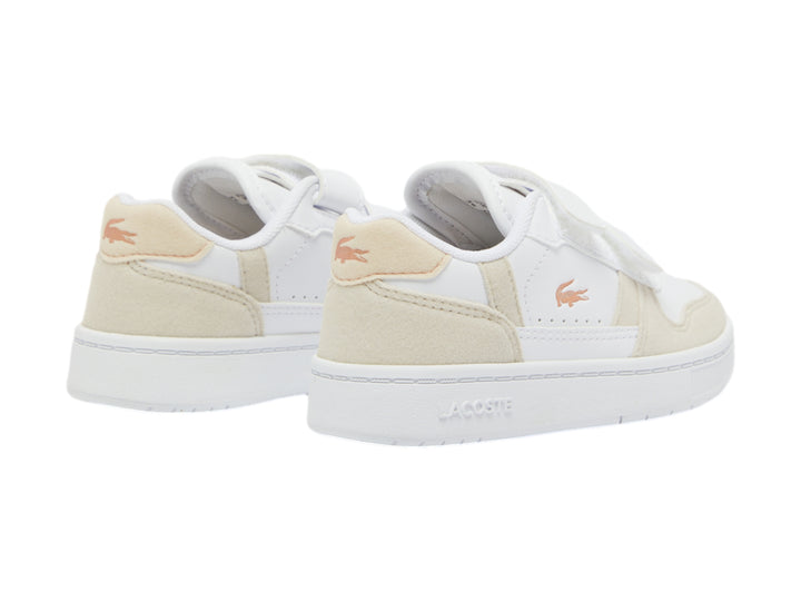 Tenis blancos con detalles en rosa claro y cierre de velcro de la marca Lacoste.
