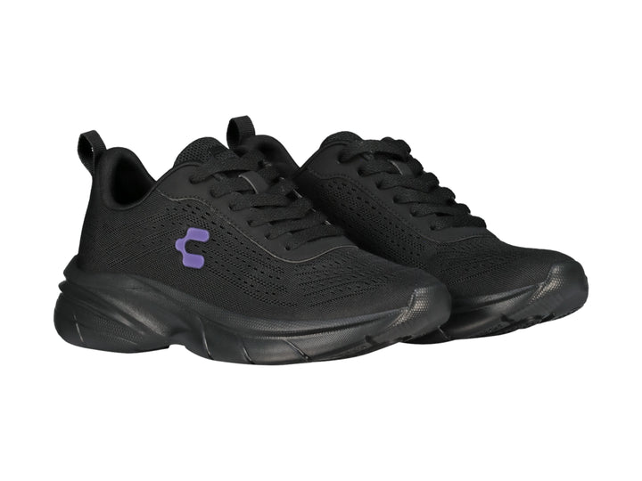 Tenis deportivos Charly color negro con detalle en morado y suela robusta.