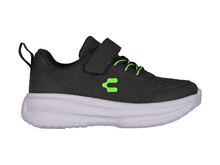 Tenis Charly color negro con suela blanca, cierre de velcro y detalles en verde neón para niño.