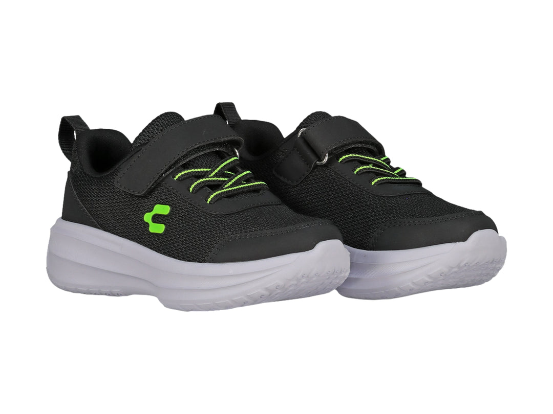 Tenis Charly color negro con suela blanca, cierre de velcro y detalles en verde neón para niño.