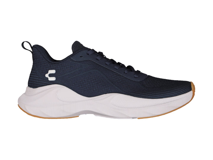 Tenis deportivos Charly en color negro con suela blanca y detalles en miel, diseño ligero para deporte.