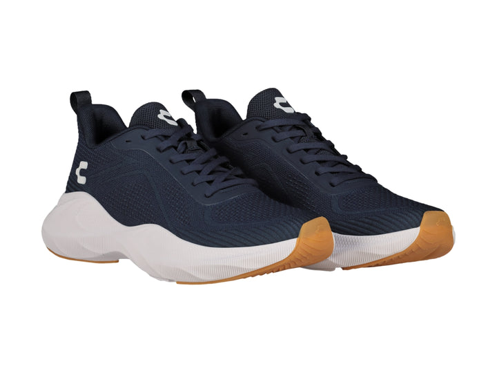 Tenis deportivos Charly en color negro con suela blanca y detalles en miel, diseño ligero para deporte.