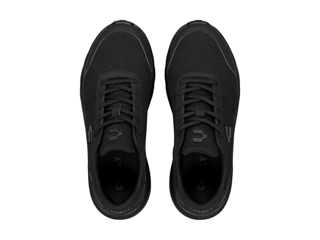 Tenis casuales Charly color negro con suela gruesa y tejido transpirable.
