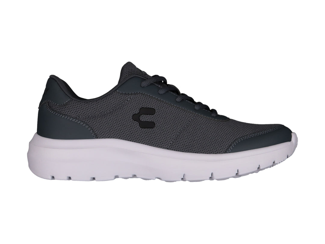 Tenis casuales Charly color gris con suela blanca y tejido de malla.