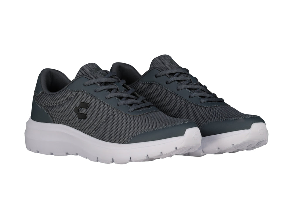 Tenis casuales Charly color gris con suela blanca y tejido de malla.
